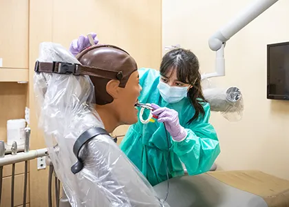 dental student working on sim page