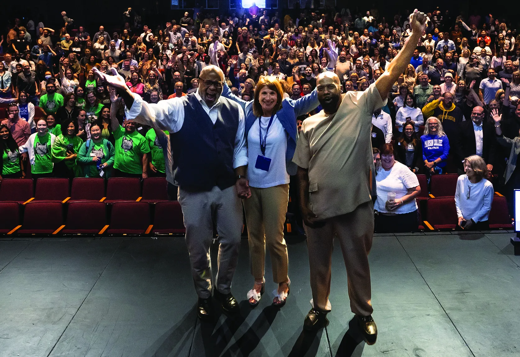 President Berne posing for a selfie with a crowd of employees, in the Mitby Theatre.