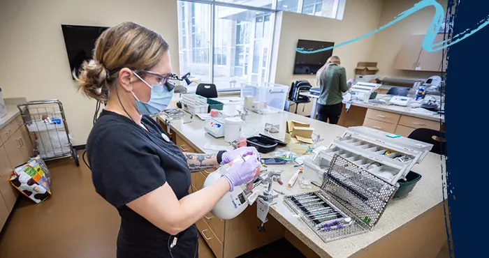 Student working on a model in a the Expanded Function Dental Auxiliary clinic