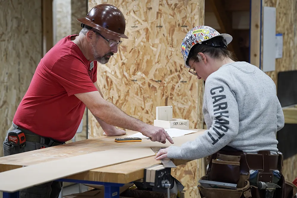 Faculty with student in a construction lab