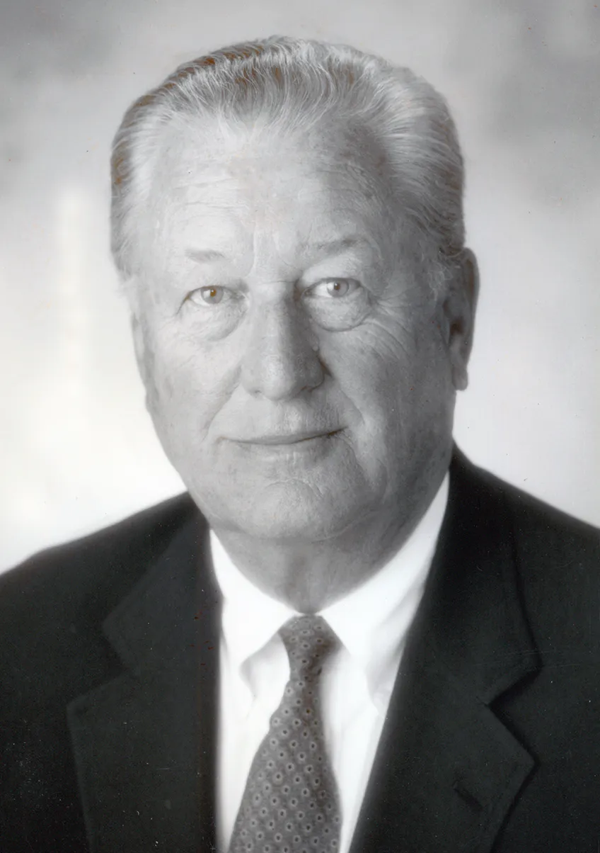J Frautschi in a dark blazer and tie.