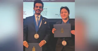 Student with dark hair and mustache with blue blazer, and student with dark hair and dark blazer. Both are posing with medals and certificates naming them nation's top scholar.