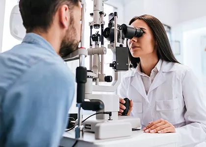 Two people in an eye exam