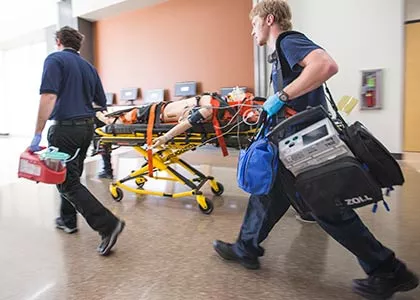 Students moving patient