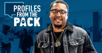 Jason Boatright in black leather jacket in front of blue Profiles from the Pack logo.