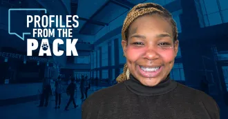 Myra Crump smiling, wearing a brown headband and black turtleneck, in Profiles from the Pack logo.
