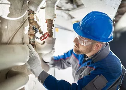 person fixing plumbing